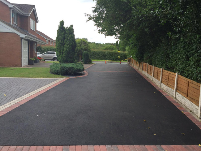 New tarmac driveway with block paved edging and apron