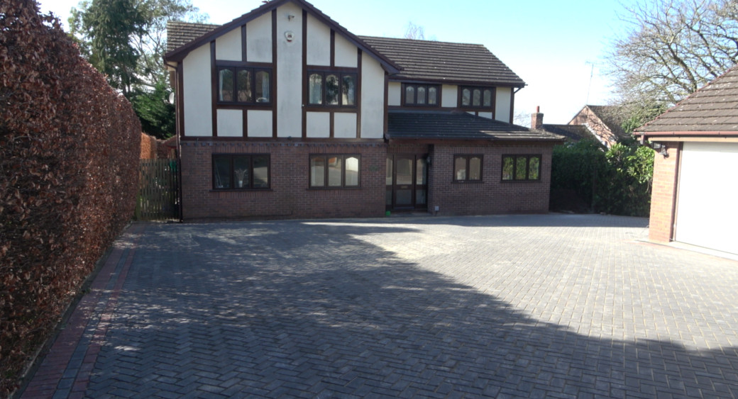 Full width block paved driveway to a detached house