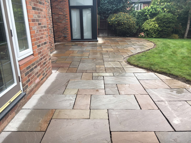 Indian sandstone patio laid in random courses