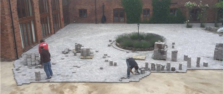 Large courtyard being block paved at a barn conversion